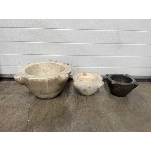 181A - A large white marble mortar, with four lugs, carved from a single block of marble, height 23cm, aver... 