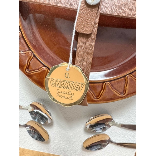 196 - A mid century, as new 'Brexton' picnic set for four, to include: a case with two orange, brown and b... 