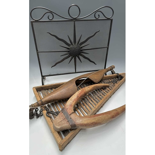 201 - A black painted fire screen, wrought iron frame with central sunburst, scrolled top, height 62cm, wi... 