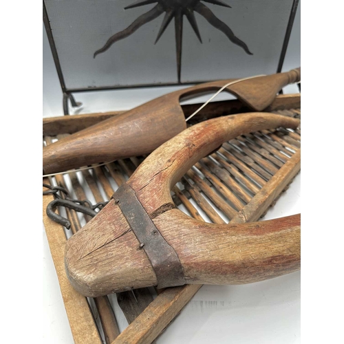 201 - A black painted fire screen, wrought iron frame with central sunburst, scrolled top, height 62cm, wi... 