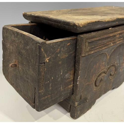 204 - A Tibetan wood and copper-bound altar with lockable drawer, 19th century or earlier, ruyi carved dec... 