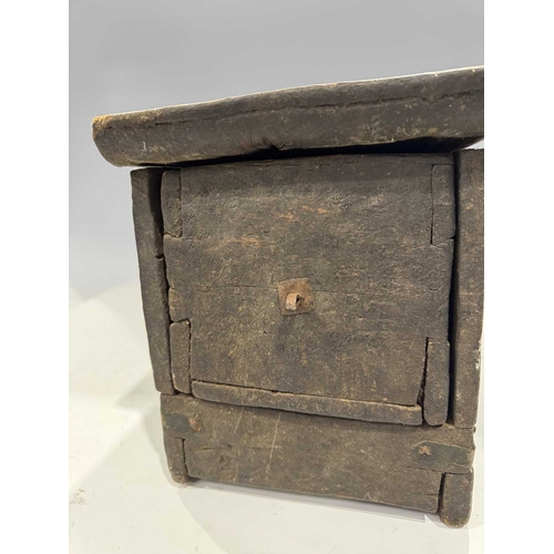 204 - A Tibetan wood and copper-bound altar with lockable drawer, 19th century or earlier, ruyi carved dec... 