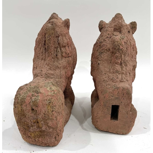 211 - A pair of Nepalese shrine guardians, polychrome wood, carved as mythical snow lions, associated with... 