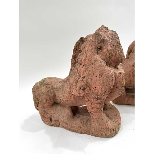 211 - A pair of Nepalese shrine guardians, polychrome wood, carved as mythical snow lions, associated with... 