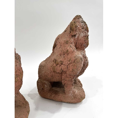 211 - A pair of Nepalese shrine guardians, polychrome wood, carved as mythical snow lions, associated with... 