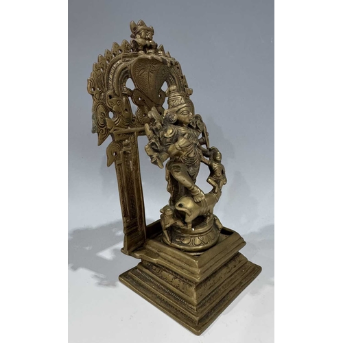212 - A bronze shrine, Bengal, depicting the multi-armed figure of Durga or Chandiki, depicted in a dancin... 