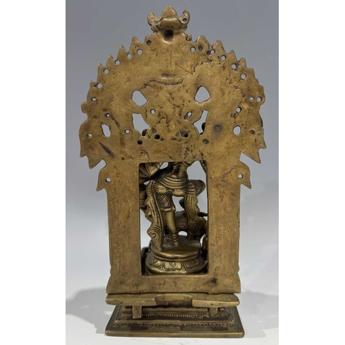 212 - A bronze shrine, Bengal, depicting the multi-armed figure of Durga or Chandiki, depicted in a dancin... 