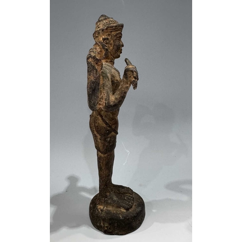 213 - A Khmer type bronze figure of a four-armed Vishnu, 19th century or earlier, standing atop a circular... 