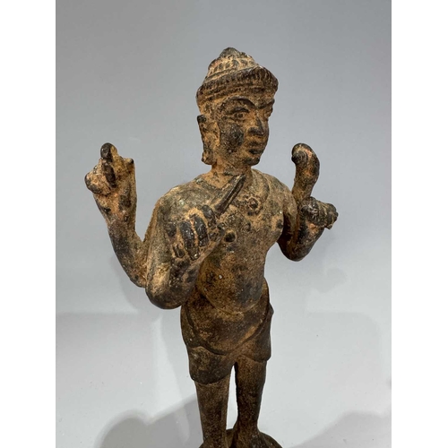 213 - A Khmer type bronze figure of a four-armed Vishnu, 19th century or earlier, standing atop a circular... 