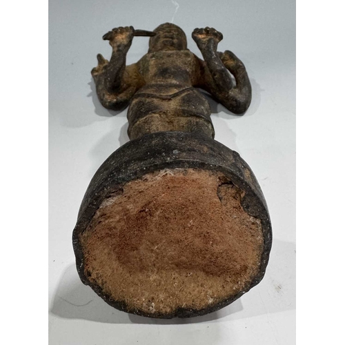 213 - A Khmer type bronze figure of a four-armed Vishnu, 19th century or earlier, standing atop a circular... 