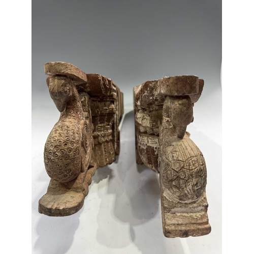 222 - A pair of Indian carved wood decorations, Assam, likely designed to flank a doorway, relief carved p... 