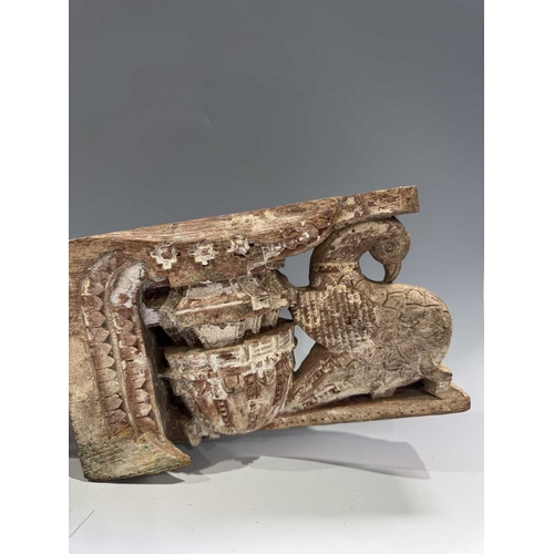 222 - A pair of Indian carved wood decorations, Assam, likely designed to flank a doorway, relief carved p... 