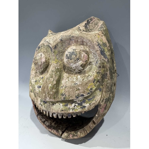 224 - A hand carved wood tiger head mask with layers of patinated polychrome decoration, modelled with poi... 