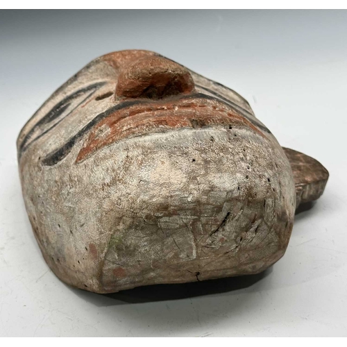 226 - A dancer's mask modelled as a stylised, anthropomorphised tiger, carved wood, with pointed red/orang... 