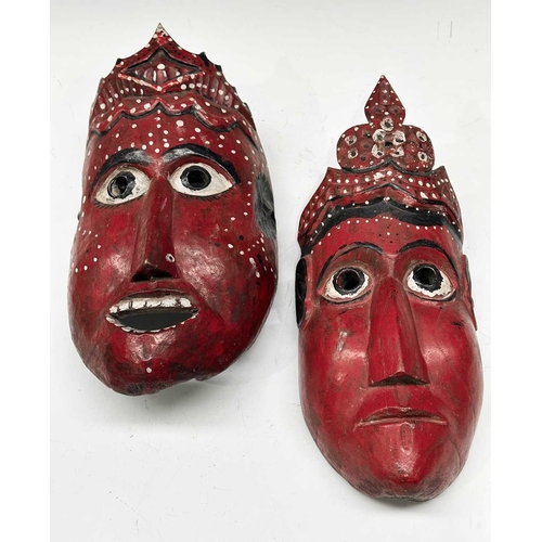 231 - Two carved wood masks modelled as the crowned Rama and Sita, eastern Nepal, likely used in the telli... 