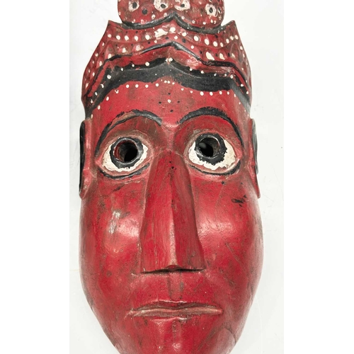 231 - Two carved wood masks modelled as the crowned Rama and Sita, eastern Nepal, likely used in the telli... 