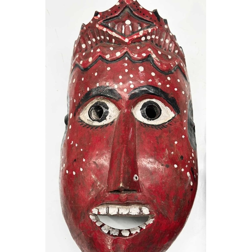 231 - Two carved wood masks modelled as the crowned Rama and Sita, eastern Nepal, likely used in the telli... 