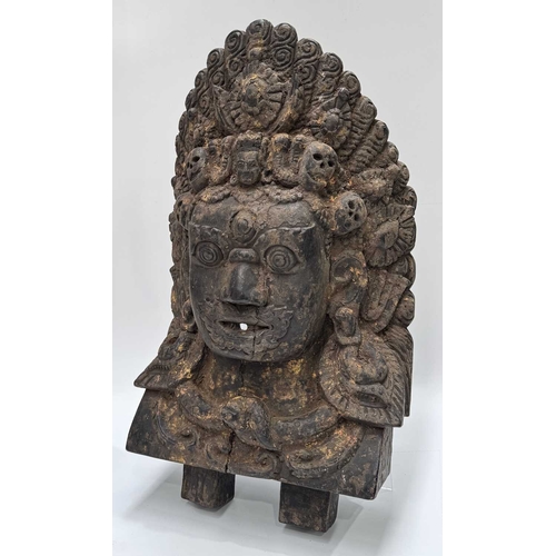 232 - A wooden shrine bust mask of Bhairava, Kathmandu valley, 18th century or earlier, ornately carved wi... 