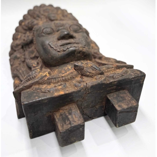232 - A wooden shrine bust mask of Bhairava, Kathmandu valley, 18th century or earlier, ornately carved wi... 