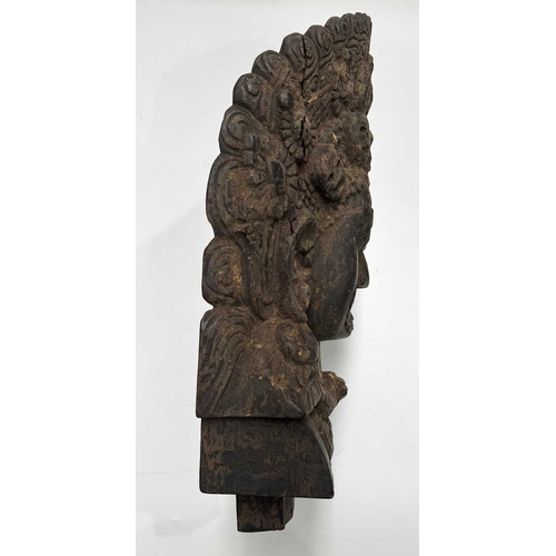 232 - A wooden shrine bust mask of Bhairava, Kathmandu valley, 18th century or earlier, ornately carved wi... 