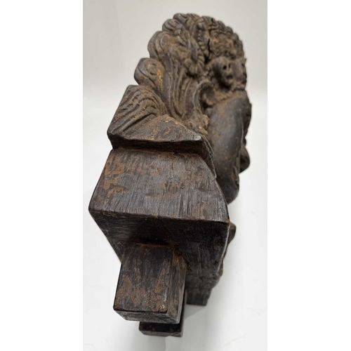 232 - A wooden shrine bust mask of Bhairava, Kathmandu valley, 18th century or earlier, ornately carved wi... 