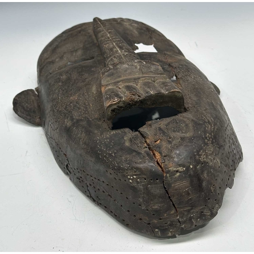 238 - An Indian large carved wood mask, elongated face with rounded protruding ears, Assam or Nagaland reg... 