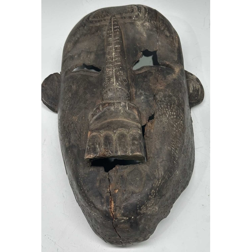 238 - An Indian large carved wood mask, elongated face with rounded protruding ears, Assam or Nagaland reg... 