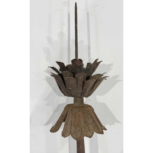 242 - Three 19th century Newari artefacts, an iron torch used in community and religious festivals, formed... 