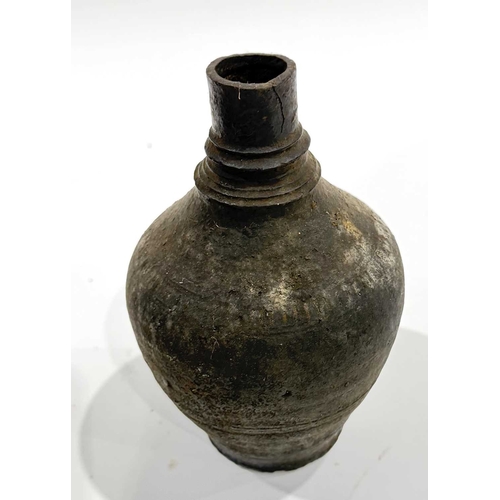 242 - Three 19th century Newari artefacts, an iron torch used in community and religious festivals, formed... 