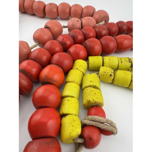 247 - Nepalese jewellery, three heavy bead necklaces and a bracelet, glass beads on string and fabric ribb... 