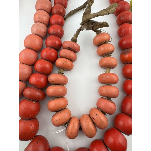 247 - Nepalese jewellery, three heavy bead necklaces and a bracelet, glass beads on string and fabric ribb... 