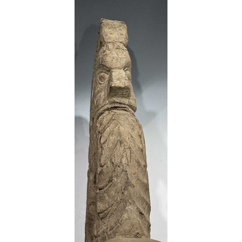 248 - An intricate relief hardwood panel, carved on both sides, modelled as a tiger breathing fire, 19th c... 