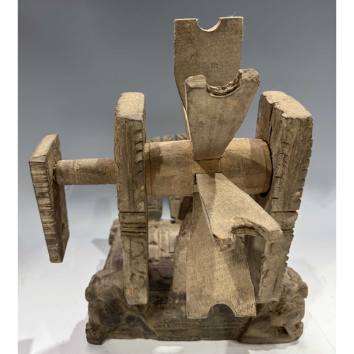 249 - A Himalayan cotton spinning wheel or charkha, 19th century or earlier, richly decorated, the corners... 