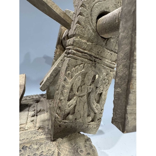 249 - A Himalayan cotton spinning wheel or charkha, 19th century or earlier, richly decorated, the corners... 