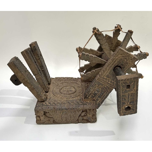 250 - A Himalayan cotton spinning wheel or charkha, 19th century or earlier, richly decorated, the top car... 