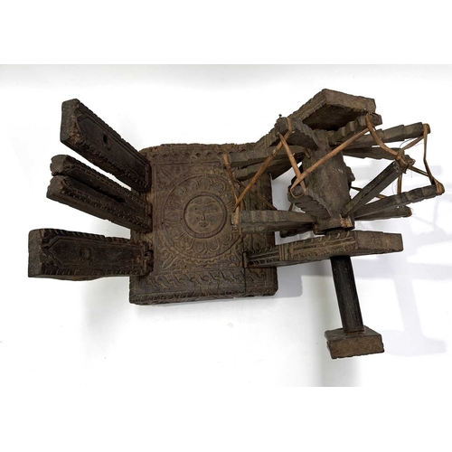 250 - A Himalayan cotton spinning wheel or charkha, 19th century or earlier, richly decorated, the top car... 