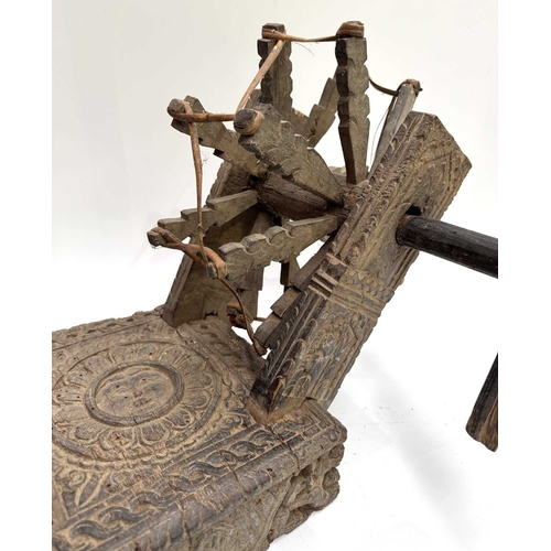 250 - A Himalayan cotton spinning wheel or charkha, 19th century or earlier, richly decorated, the top car... 