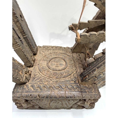 250 - A Himalayan cotton spinning wheel or charkha, 19th century or earlier, richly decorated, the top car... 