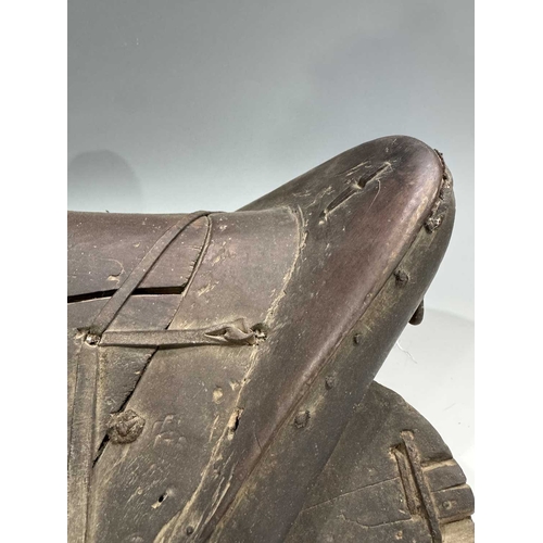 255 - Two Himalayan pony saddles, Mustang, on the Nepal/Tibet border, late 19th/early 20th century, carved... 