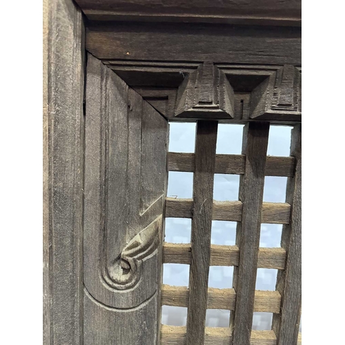 263 - A 19th century or earlier Nepalese wooden window, dentil carving above open lattice grill, Kathmandu... 