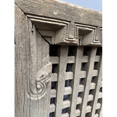 264 - Architectural salvage for decorative use, or as a garden feature, a Nepalese wooden window, 'H'-form... 