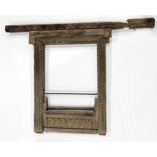 266 - A richly carved Nepalese window frame, 19th century or earlier, salvaged from a noble house or palac... 