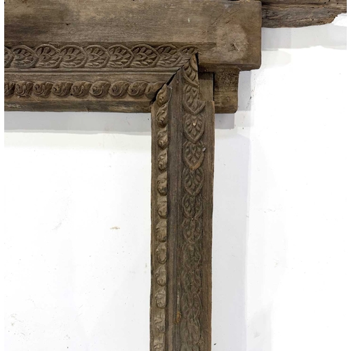 266 - A richly carved Nepalese window frame, 19th century or earlier, salvaged from a noble house or palac... 