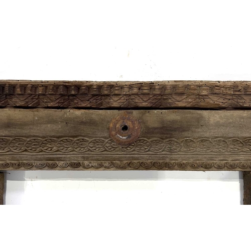 266 - A richly carved Nepalese window frame, 19th century or earlier, salvaged from a noble house or palac... 