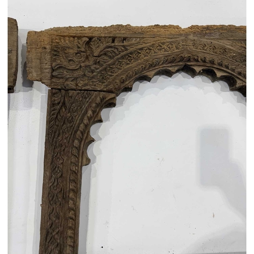 267 - A pair of richly carved Nepalese sectional window frames, 19th century or earlier, salvaged from a n... 