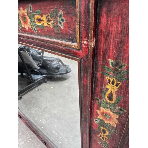 285 - A contemporary Tibetan mirror, panelled wood frame painted with floral motifs, 102 by 102cm, togethe... 