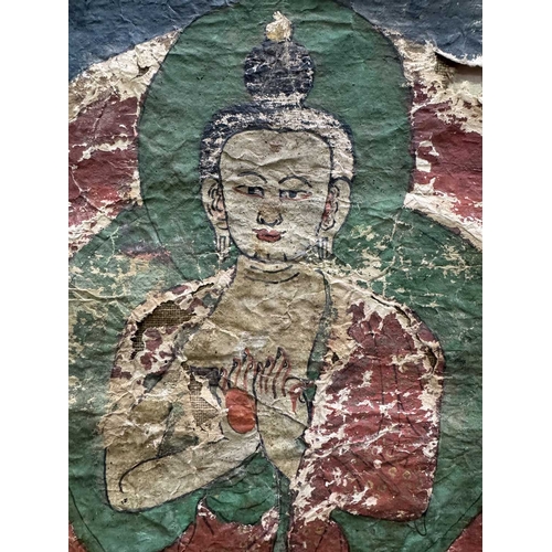 288 - A Tibetan thangka painting of the Vairocana Buddha, 17th century, shown seated on a lotus throne hol... 