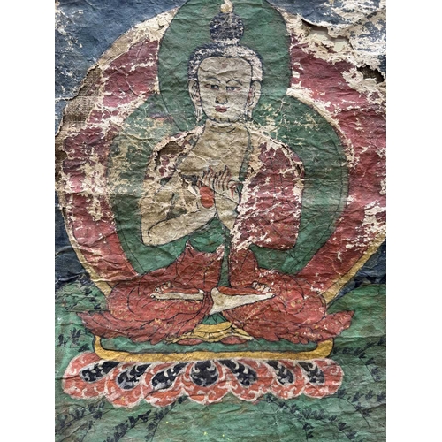 288 - A Tibetan thangka painting of the Vairocana Buddha, 17th century, shown seated on a lotus throne hol... 