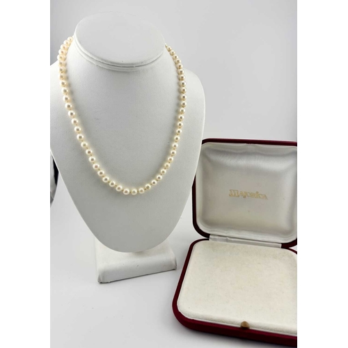 336 - A cultured pearl necklace, clasp stamped 585