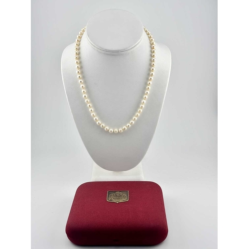 336 - A cultured pearl necklace, clasp stamped 585